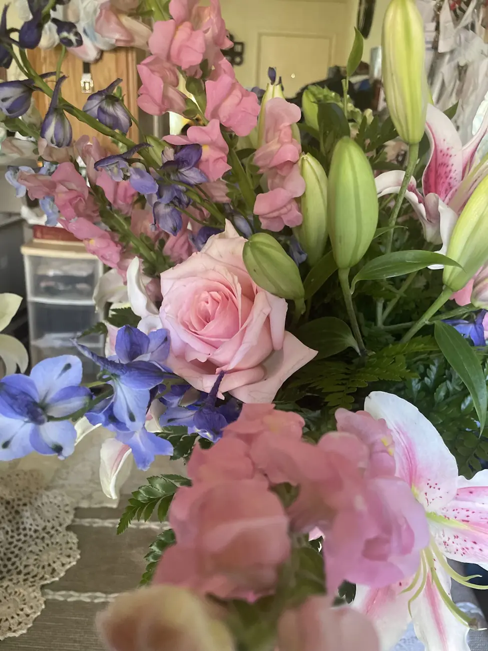 Arrangement with pink lilies and roses